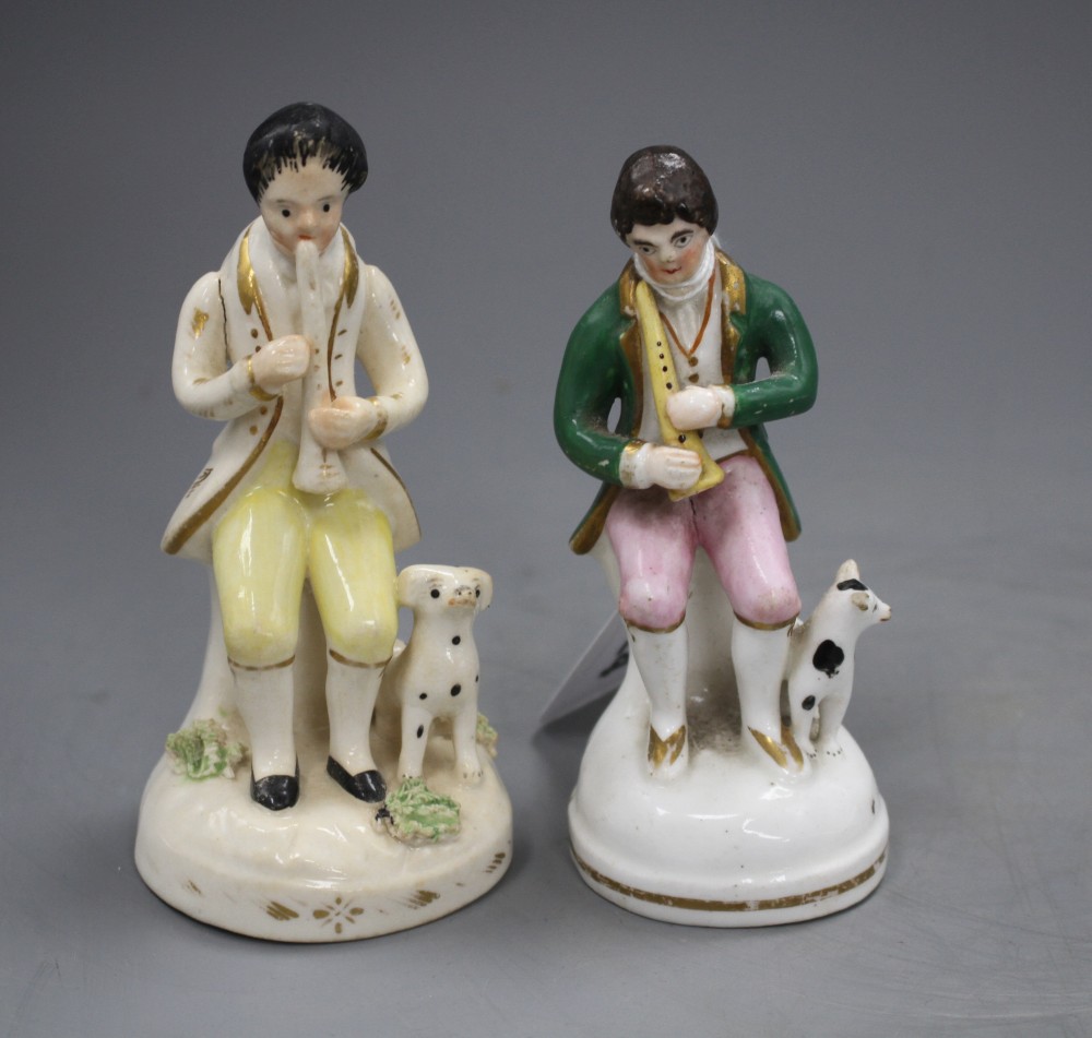 Two Staffordshire porcelain figures of musicians seated by a dog, c.1840-50, H. 11.5 - 12cm